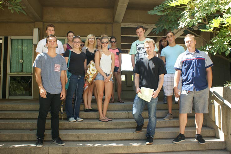 A large group of students standing on a stairway.